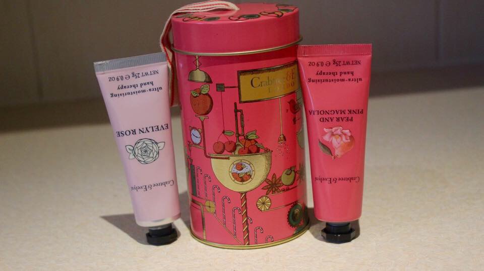 a small tin with two hand cream tubes inside.