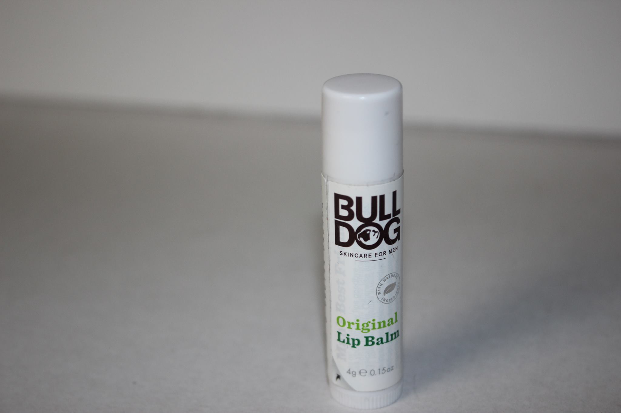 A picture of a small lip balm twist up tube.