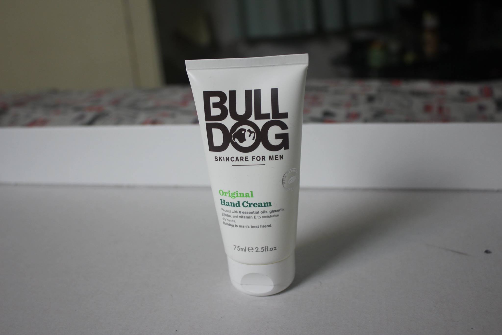 A cone shaped bottle of hand cream.