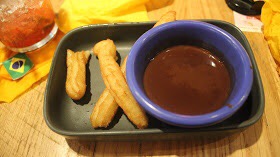 Some Churros and Chocolate Sauce.
