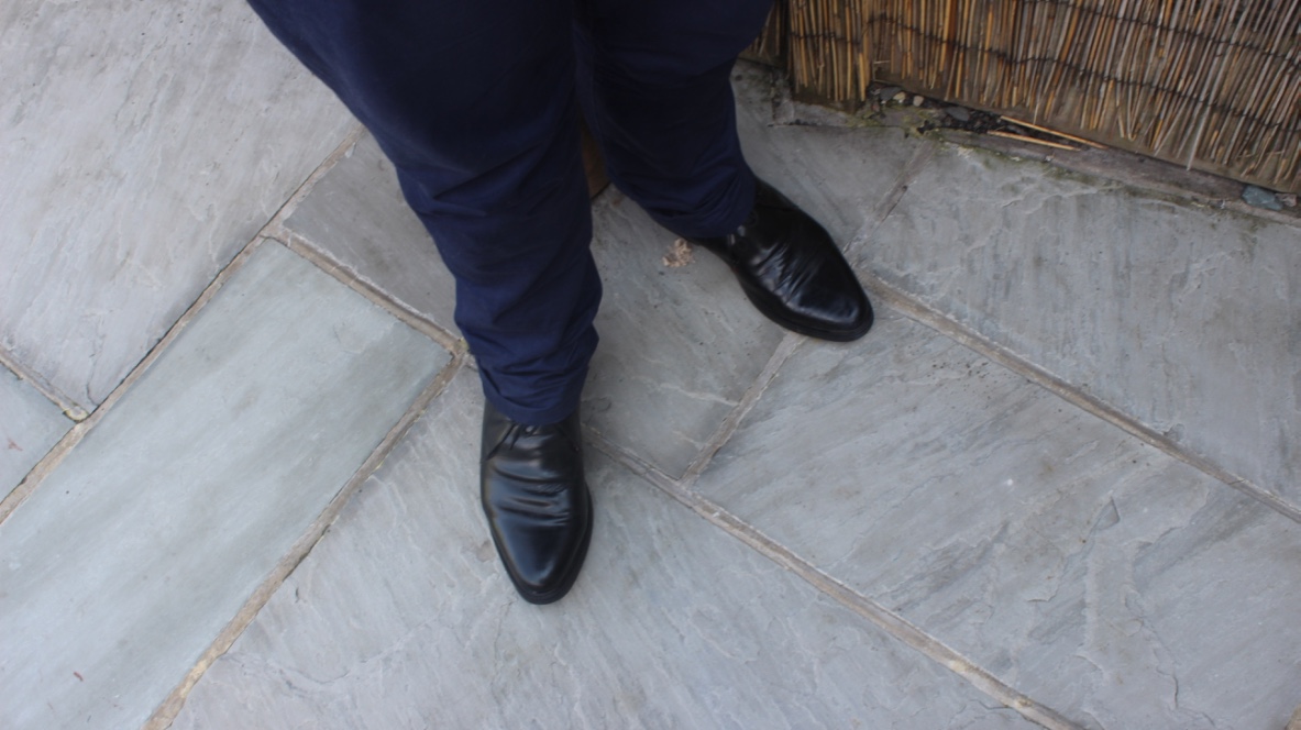 A picture of me wearing a pair of black leather boots.