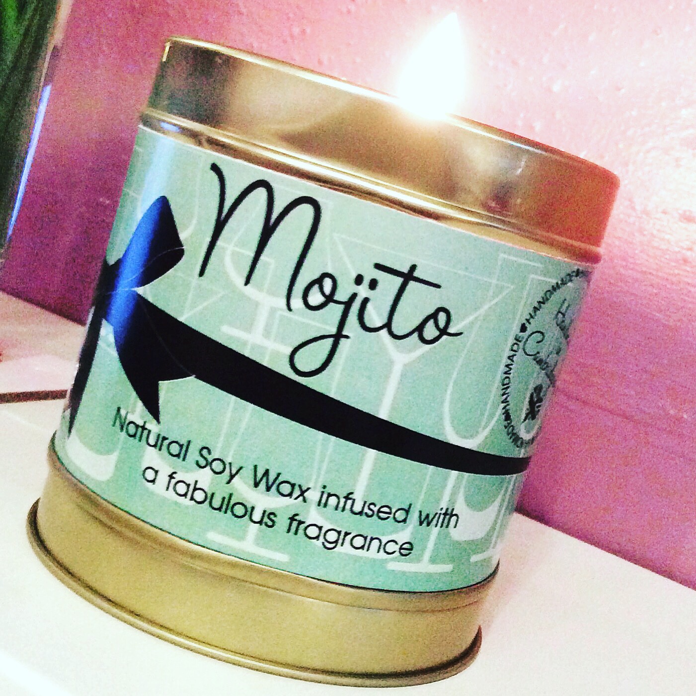 A short, fat, candle tin.