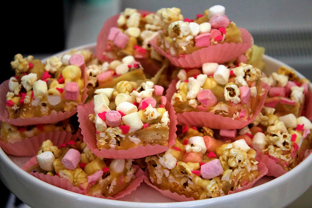 Some nude Rocky Roads, in pink cases, on a grey background.
